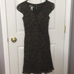 Black silk dress with beige flowers